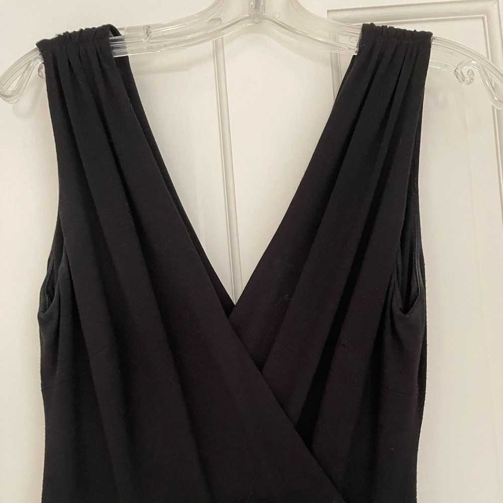 Knit black jumpsuit (crisscross top…fitted waist …stovepipe leg)